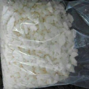 A clear plastic bag containing crystalline white granules, labeled as MDPBP Hydrochloride Solution, indicating high purity.